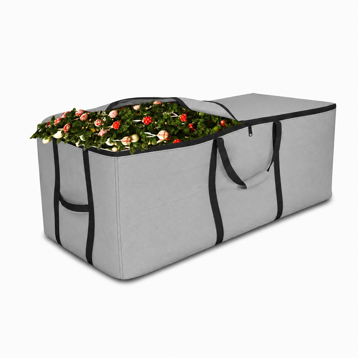 A large gray expandable holiday wreath storage bag with black trim, shown open and filled with a green wreath decorated with red and pink ornaments, on a plain white background. - view 2