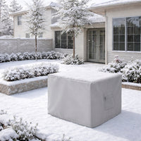 Custom outdoor furniture cover protecting a patio ottoman in a snow-covered backyard – ZIPCovers weatherproof cover built for all-season protection
