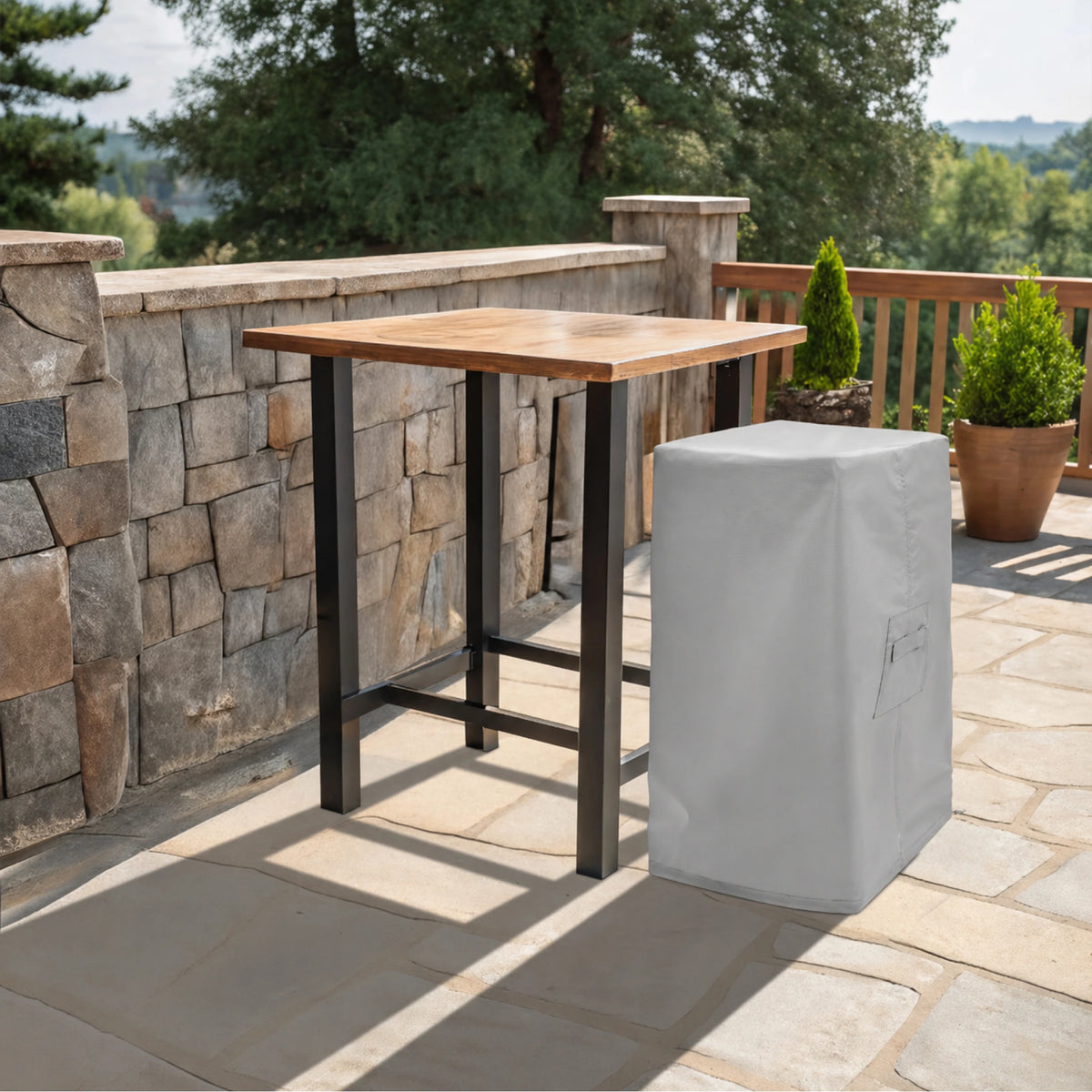Custom Square Chiminea Cover in light gray, shown on a stone patio deck next to a wooden bar table