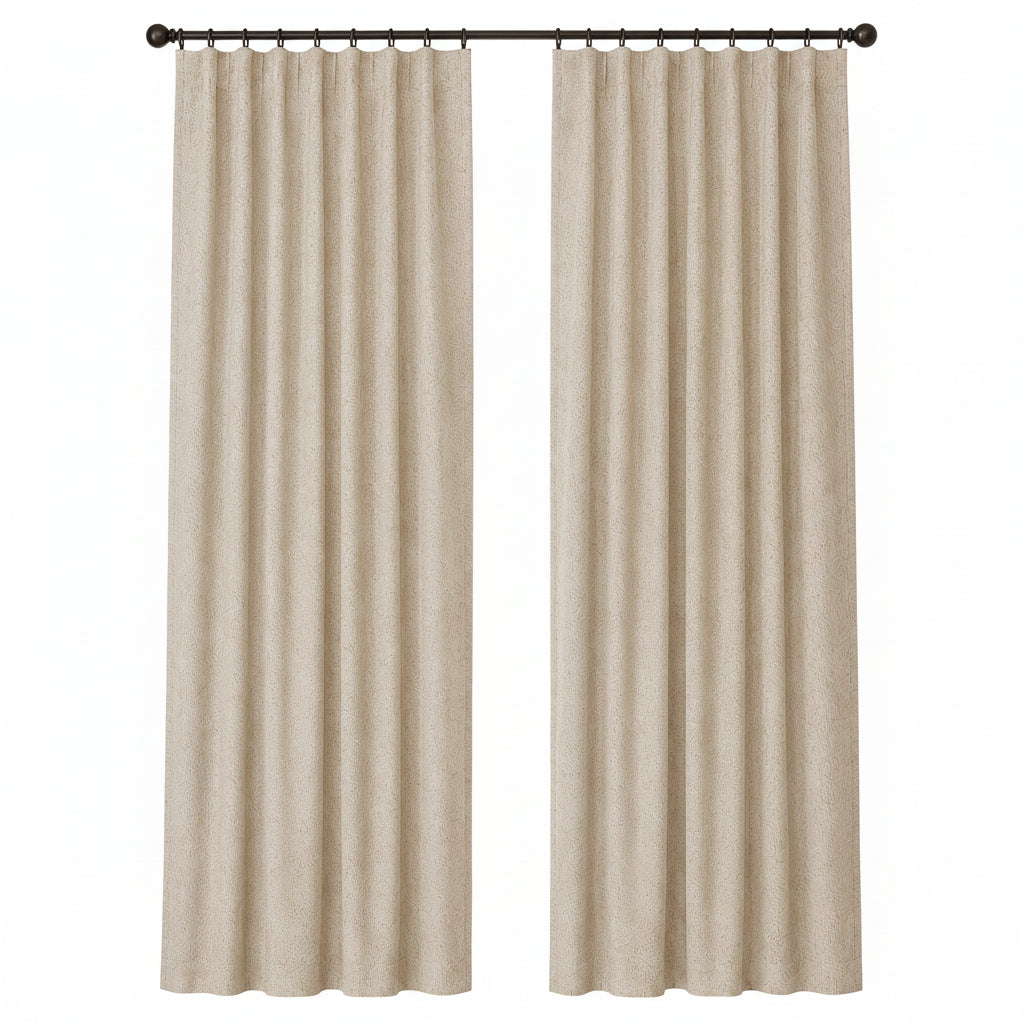 A pair of beige textured curtain panels hanging from a black rod over a window in a neutral room setting.